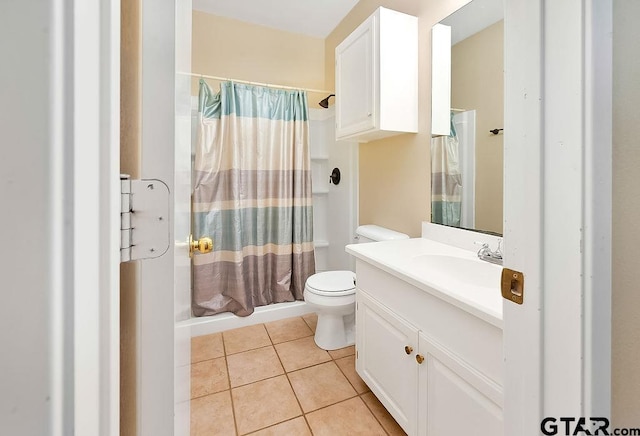 bathroom featuring vanity, tile patterned flooring, curtained shower, and toilet