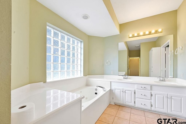 bathroom featuring vanity, tile patterned floors, and plus walk in shower