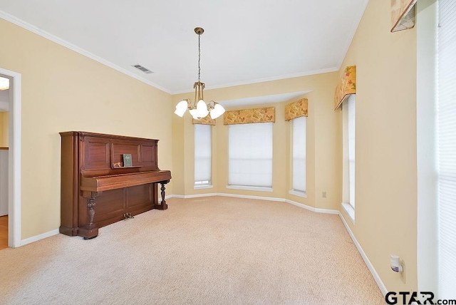 misc room featuring plenty of natural light, crown molding, and carpet