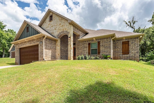 20851 Lakeview Dr, Flint, TX 75762 - view of front of property featuring brick siding, board and batten siding, a front lawn, and an attached garage