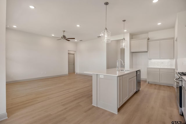 382 Mary Cir, Bullard, TX 75757 - kitchen with stainless steel appliances, ceiling fan, light wood-type flooring, recessed lighting, and tasteful backsplash