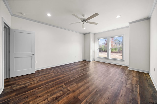 spare room featuring dark hardwood / wood-style floors, ceiling fan, and ornamental molding