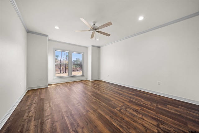 empty room with ceiling fan, dark hardwood / wood-style floors, and ornamental molding