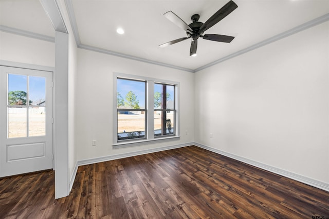 spare room with ceiling fan, dark wood-type flooring, and ornamental molding