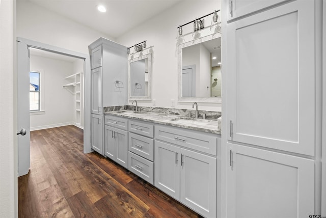 bathroom featuring vanity and hardwood / wood-style flooring