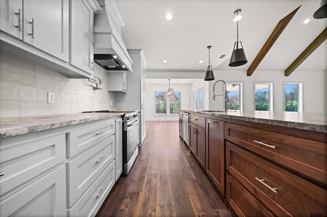 kitchen with white cabinets, appliances with stainless steel finishes, beam ceiling, and sink