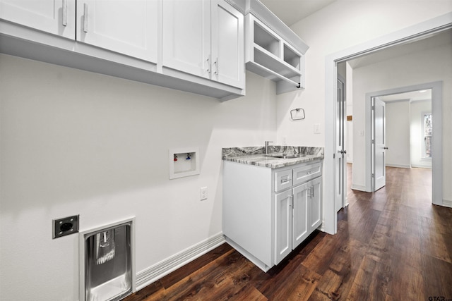 laundry area with electric dryer hookup, cabinets, sink, washer hookup, and dark hardwood / wood-style flooring