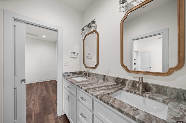 bathroom with hardwood / wood-style flooring and vanity