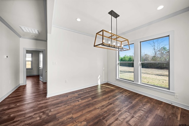 unfurnished dining area featuring dark hardwood / wood-style floors, beam ceiling, crown molding, and an inviting chandelier