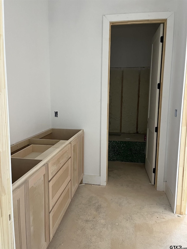 bathroom with concrete floors