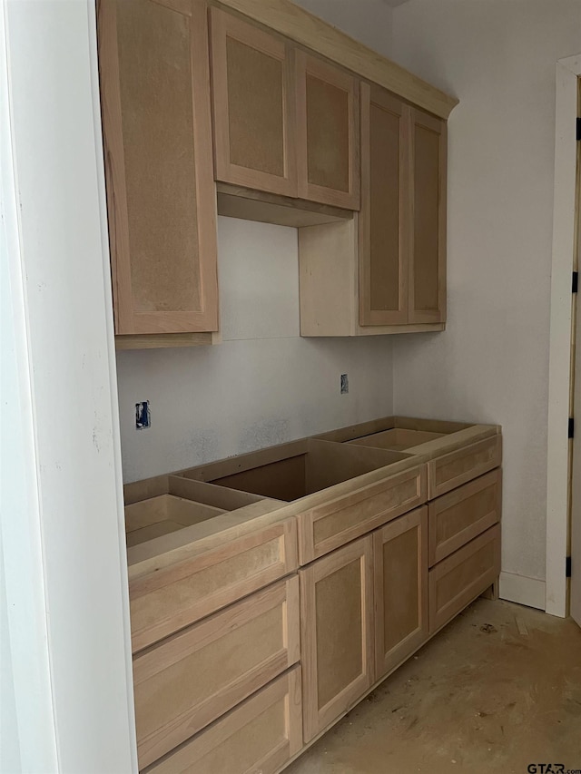 kitchen featuring light brown cabinets