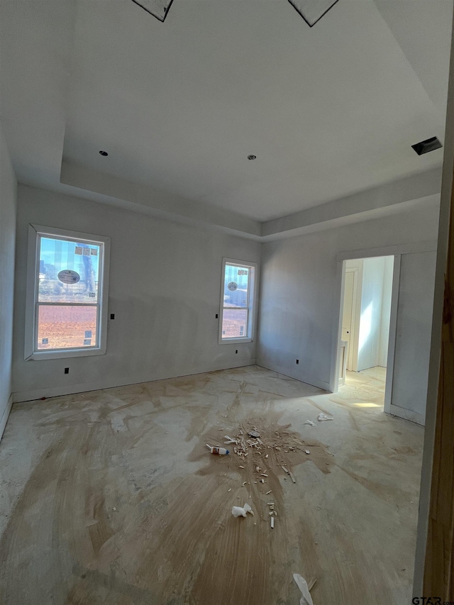 empty room with a raised ceiling