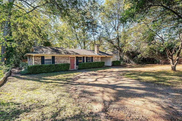 ranch-style home with a front yard