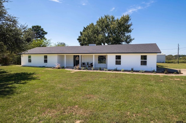 ranch-style house with a front lawn