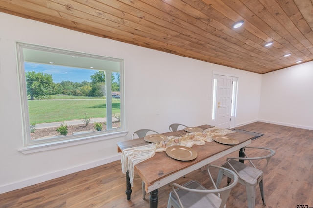 dining area with wood ceiling and hardwood / wood-style floors