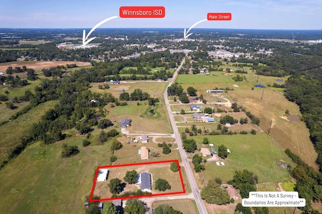 birds eye view of property featuring a rural view