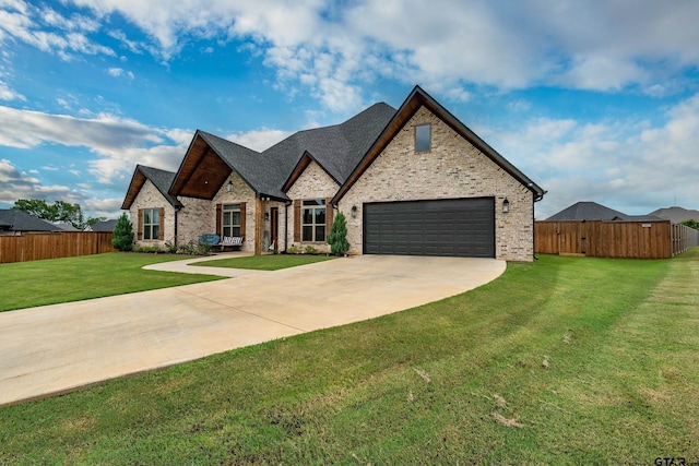 213 Serenity Dr, Bullard, TX 75757 - french country style house with driveway, an attached garage, and brick siding