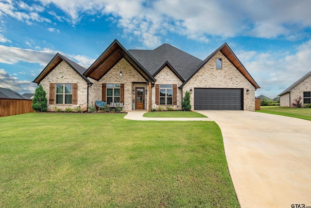 213 Serenity Dr, Bullard, TX 75757 - french provincial home featuring driveway, an attached garage, and brick siding