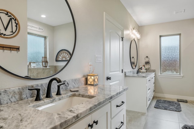 213 Serenity Dr, Bullard, TX 75757 - bathroom with two vanities and tile patterned floors