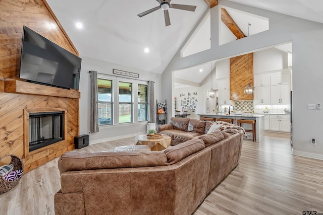 213 Serenity Dr, Bullard, TX 75757 - living area with light wood-type flooring, a fireplace, a ceiling fan, high vaulted ceiling, and recessed lighting