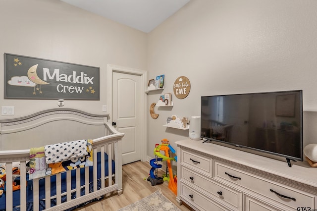 213 Serenity Dr, Bullard, TX 75757 - bedroom with light wood-style flooring and a nursery area