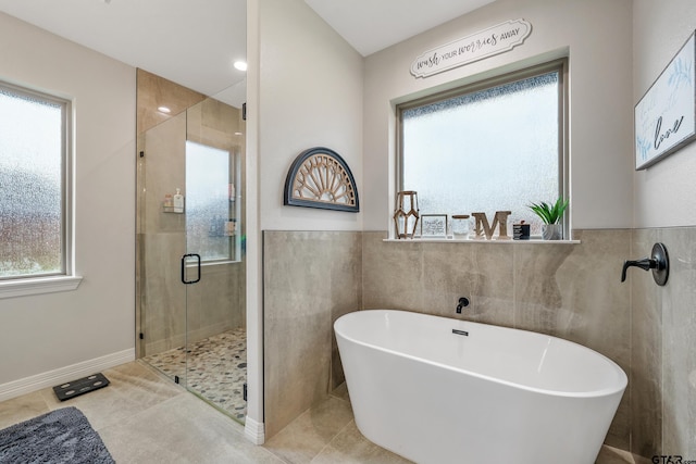 213 Serenity Dr, Bullard, TX 75757 - full bathroom featuring a stall shower, a freestanding tub, tile walls, and tile patterned flooring