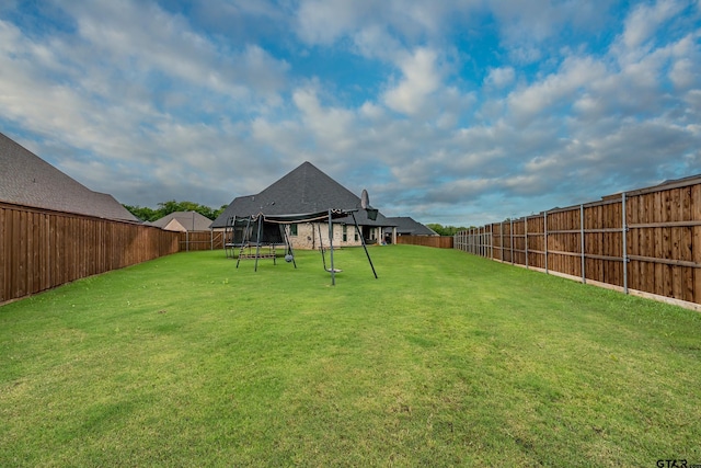 213 Serenity Dr, Bullard, TX 75757 - fenced backyard with a trampoline