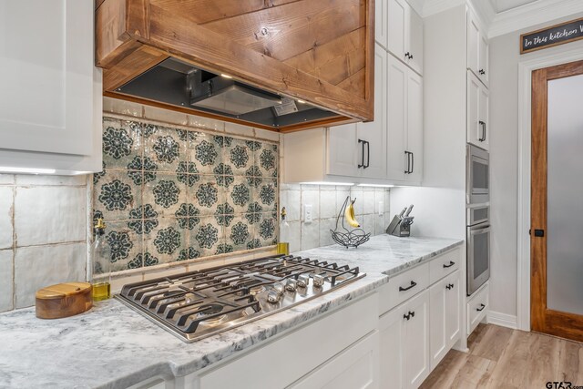 213 Serenity Dr, Bullard, TX 75757 - kitchen with stainless steel appliances, custom range hood, decorative backsplash, white cabinets, and light stone counters