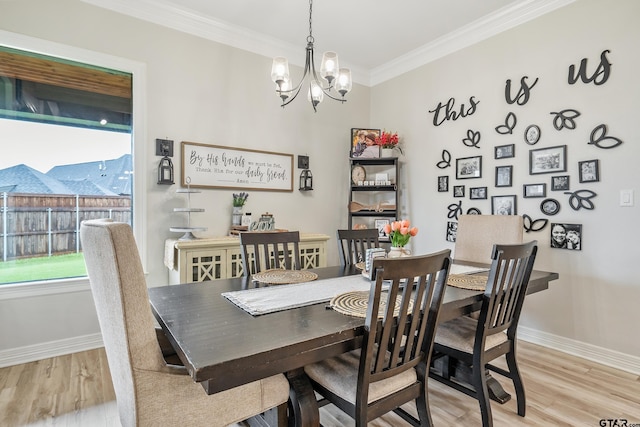 213 Serenity Dr, Bullard, TX 75757 - dining room featuring healthy amount of natural light, a chandelier, light wood-type flooring, and crown molding