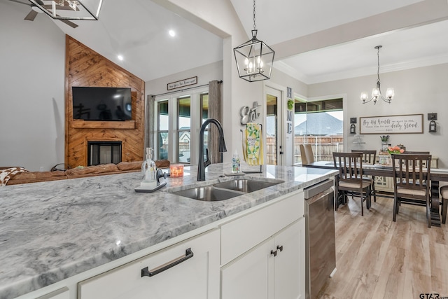 213 Serenity Dr, Bullard, TX 75757 - kitchen featuring a chandelier, open floor plan, light stone counters, decorative light fixtures, and vaulted ceiling