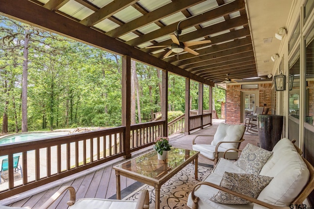 deck with a ceiling fan, an outdoor hangout area, and an outdoor pool