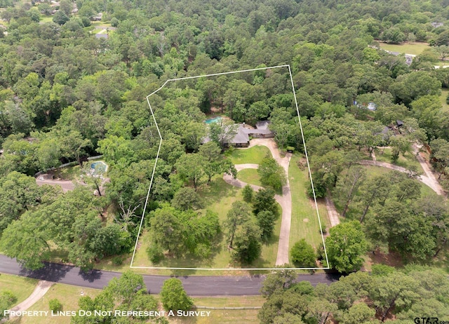 aerial view with a wooded view