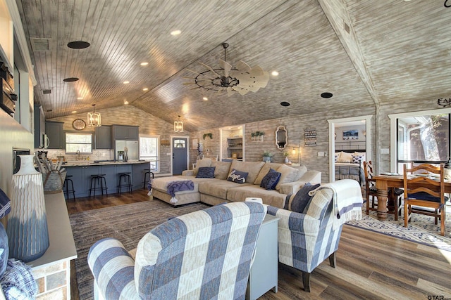 living room with dark wood-type flooring, ceiling fan, high vaulted ceiling, and wooden ceiling