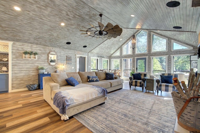 living room with high vaulted ceiling, light hardwood / wood-style flooring, wooden ceiling, and ceiling fan