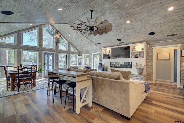 living room featuring hardwood / wood-style floors, a wealth of natural light, and wood ceiling