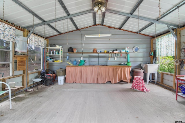 garage featuring wooden walls