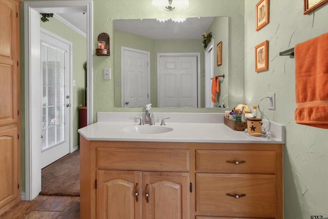 bathroom with vanity, tile patterned floors, and ornamental molding