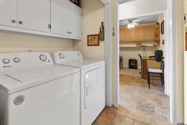 clothes washing area featuring cabinets, washer and clothes dryer, and ceiling fan