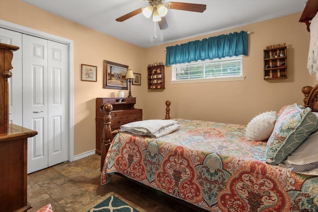 bedroom with ceiling fan and a closet