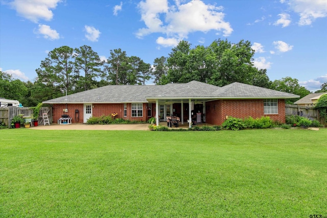 view of front of property with a front lawn and a patio