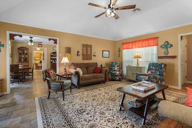 living room with ornamental molding and ceiling fan