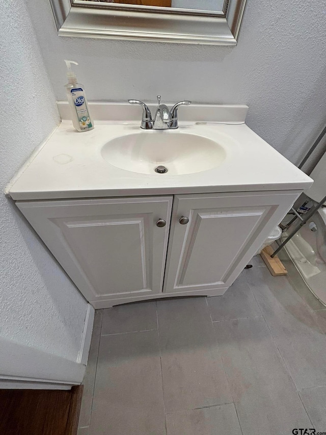 bathroom with vanity and tile patterned floors