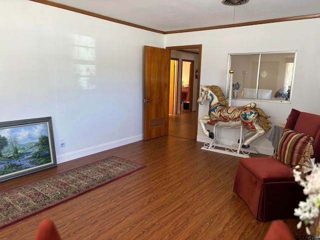 living room featuring ornamental molding and hardwood / wood-style floors