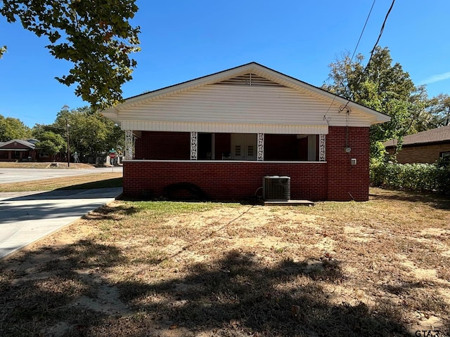 view of side of home with central air condition unit