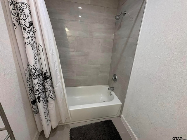 bathroom with shower / bath combo with shower curtain