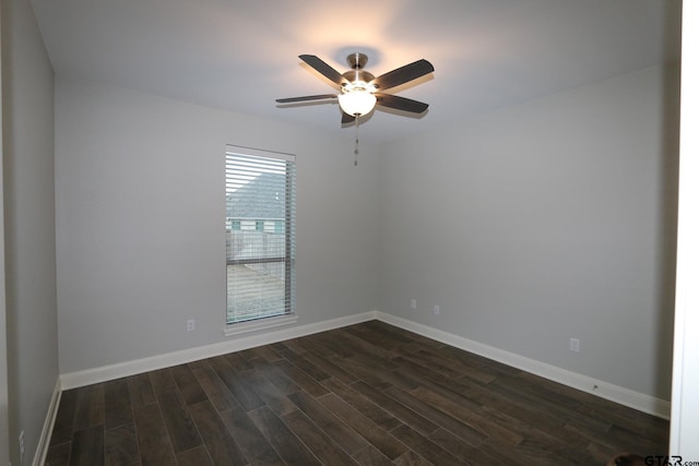 unfurnished room with dark wood-type flooring and ceiling fan