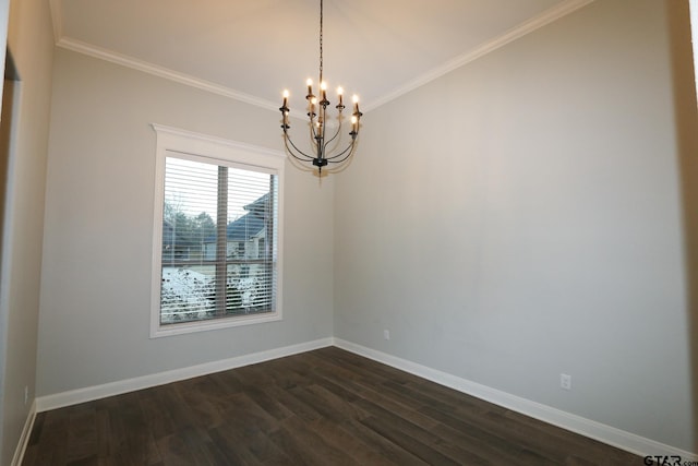 spare room with ornamental molding, dark wood-type flooring, and a notable chandelier