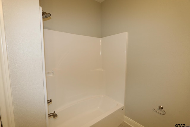 bathroom featuring washtub / shower combination