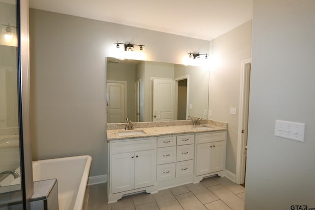 bathroom featuring vanity and a bath