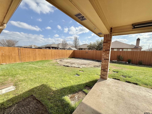 view of yard with a patio area and a fenced backyard